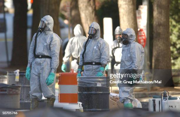 Marines with the Chemical Biological Incident Responce Force working in hazmat gear as they decontaminate the Longworth House Office building of...