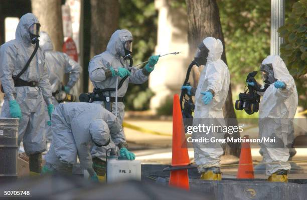 Marines with the Chemical Biological Incident Responce Force working in hazmat gear as they decontaminate the Longworth House Office building of...