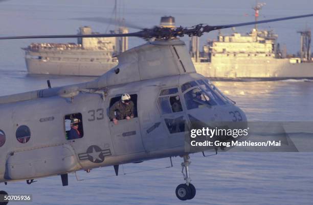 Helicopter approaching the flight deck of USS Peleliu . USS Peleliu is the flagship of an Amphibious Ready Group operating in support of Operation...