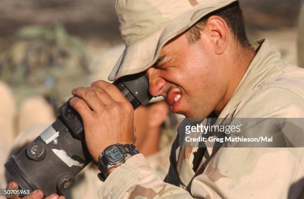 Marine Lance Cpl. Aaron Bennett of the 26th Marine Expeditionary Unit , looking through PVS-4 starlight scope for the Shoulder Fired Multi-Purpose...