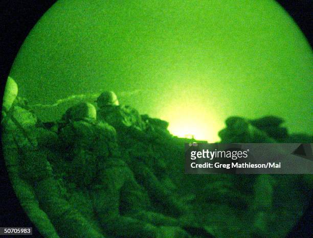 Marines from the 26th Marine Expeditionary Unit taking up defensive positions at the Kandahar airport after shots were fired near the northern...