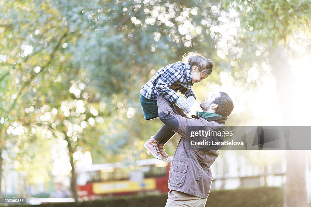 Father with daughter playing in the park