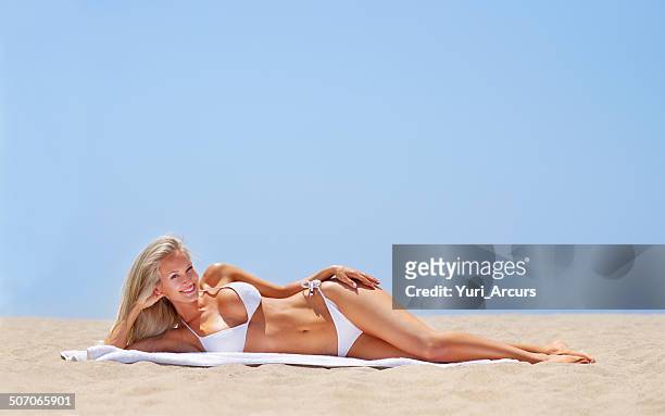she's heating up the beach! - skinny blonde pics stock pictures, royalty-free photos & images