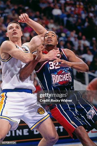 Othello Harrington of the Houston Rockets boxes out against the Golden State Warriors circa 1997 at the Arena in Oakland in Oakland, California. NOTE...