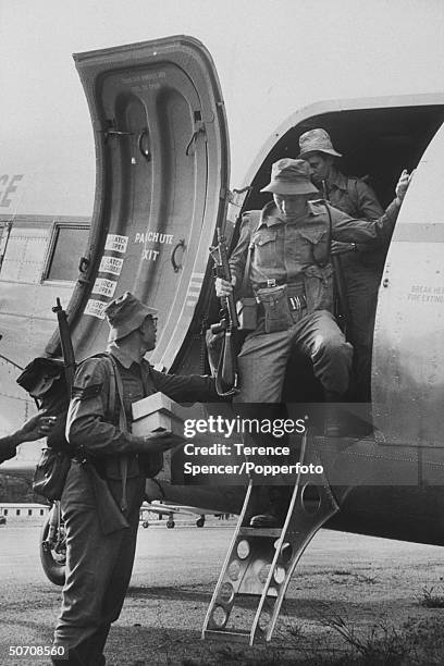 Members of royal Rhodesia regiment diplaning from Salisbury on way to Kariba Dam police camp to guard installation during stike of African workers.