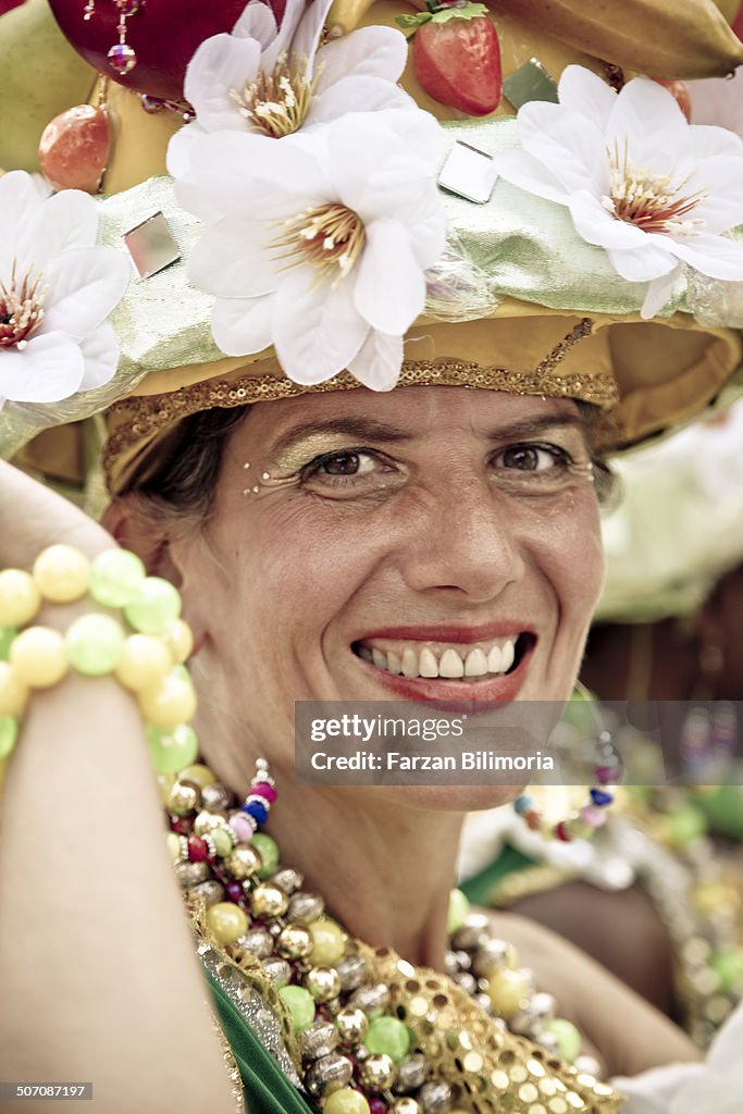 Female dancer with flowery hat at Carnival