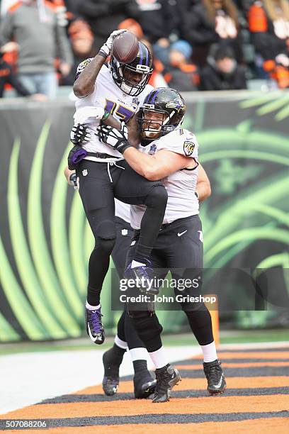 Jeremy Butler and Marshal Yanda of the Baltimore Ravens celebrate a touchdown during their game against the Cincinnati Bengals at Paul Brown Stadium...