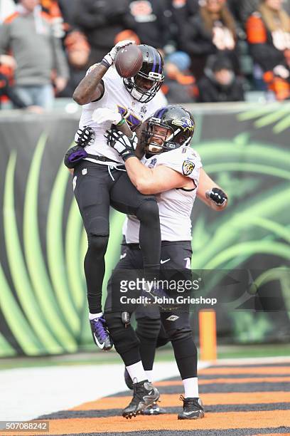 Jeremy Butler and Marshal Yanda of the Baltimore Ravens celebrate a touchdown during their game against the Cincinnati Bengals at Paul Brown Stadium...
