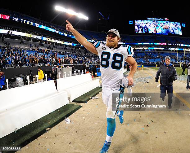 Greg Olsen of the Carolina Panthers celebrates after the NFC Championship Game against the Arizona Cardinals at Bank Of America Stadium on January...