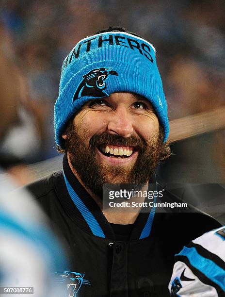 The injured Jared Allen of the Carolina Panthers watches play against the Arizona Cardinals during the NFC Championship Game at Bank Of America...
