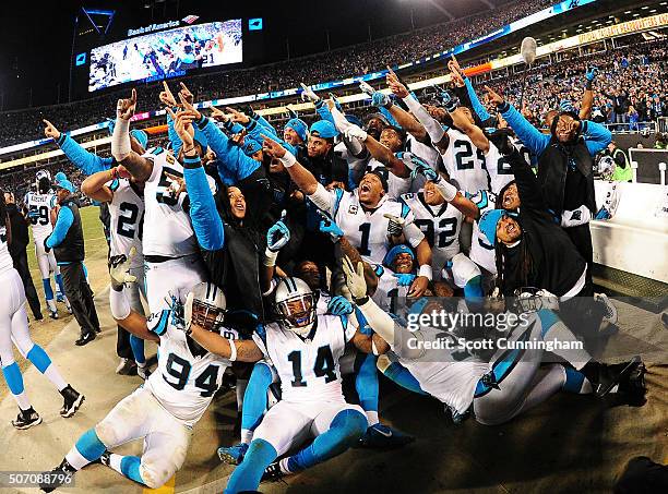 Cam Newton of the Carolina Panthers celebrates with teammates late in the NFC Championship Game against the Arizona Cardinals at Bank Of America...