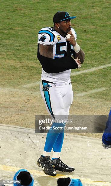Thomas Davis of the Carolina Panthers watches the action after breaking his arm against the Arizona Cardinals during the NFC Championship Game at...