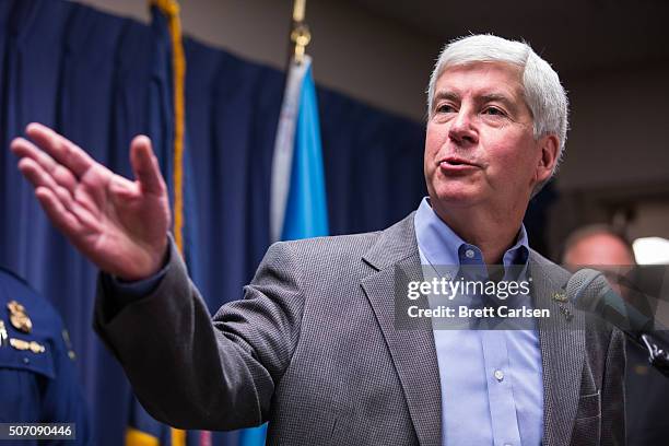 Michigan Gov. Rick Snyder speaks to the media regarding the status of the Flint water crisis on January 27, 2016 at Flint City Hall in Flint,...