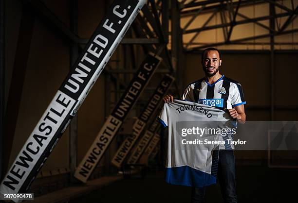 New Signing Andros Townsend poses for photographs holding a Newcastle United Named Shirt on the indoor training pitch at The Newcastle United...