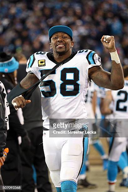 An injured Thomas Davis of the Carolina Panthers celebrates in the fourth quarter against the Arizona Cardinals during the NFC Championship Game at...