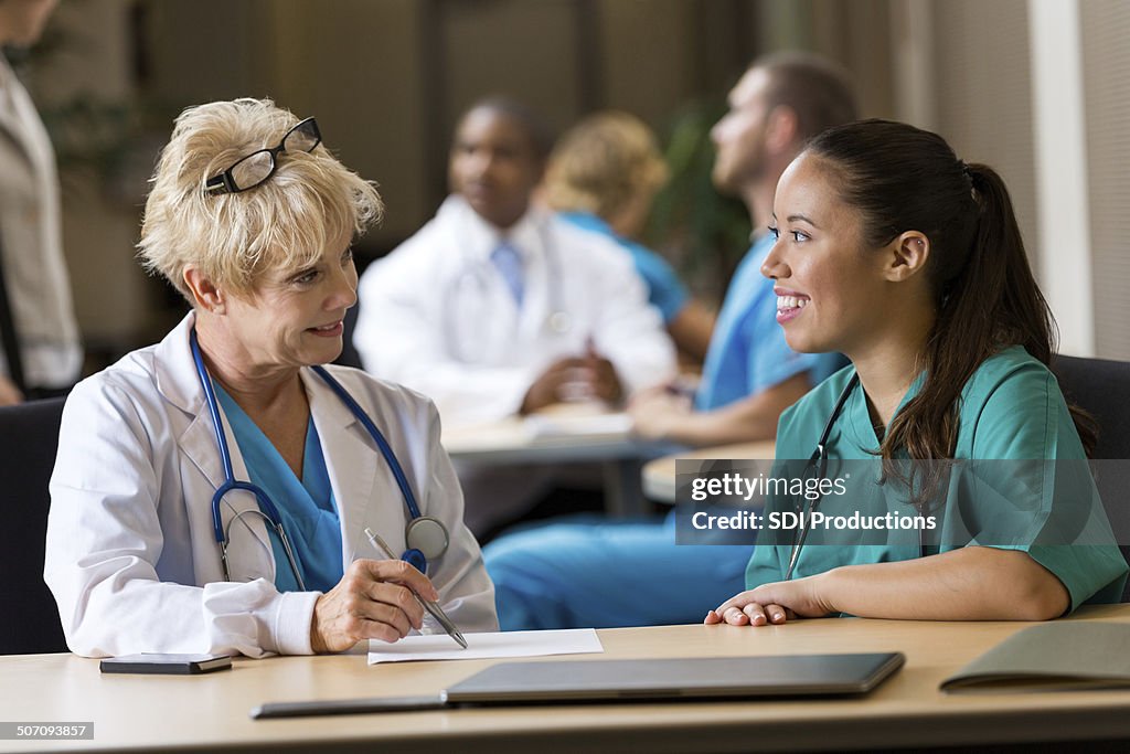 Nurse conducting interview during healthcare job fair event