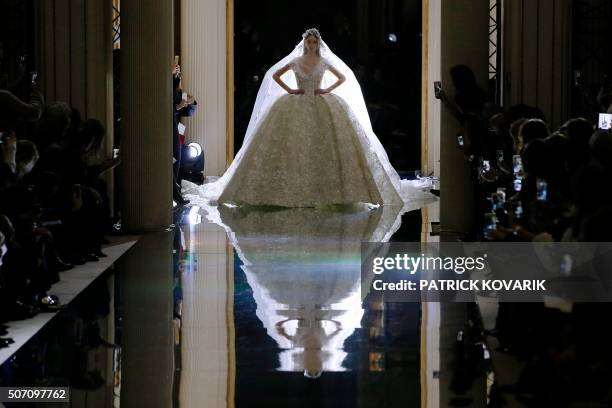 Model presents a creation by Zuhair Murad during the 2016 spring/summer Haute Couture collection on January 27, 2016 in Paris.