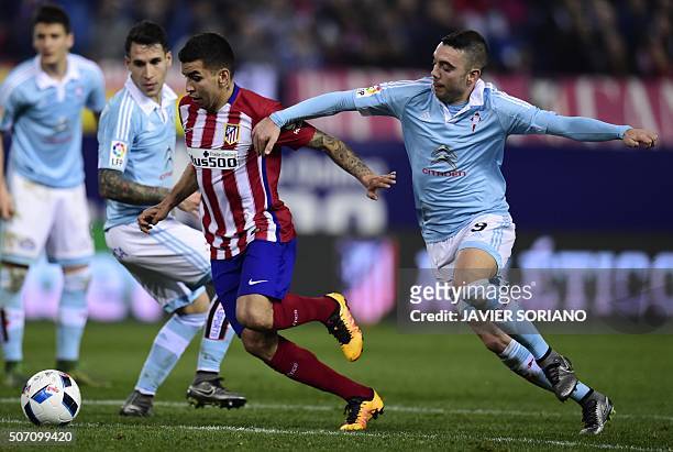 Atletico Madrid's Argentinian midfielder Angel Correa vies with Celta Vigo's forward Iago Aspas during the Spanish Copa del Rey quarterfinal second...