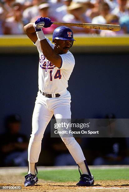 Julio Franco of the Texas Rangers bats during a Major League Baseball spring training game circa 1990 at Charlotte Sports Park in Port Charlotte,...