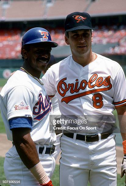Julio Franco of the Texas Rangers, Cal Ripken Jr. #8 of the Baltimore Orioles and American League All-Stars poses for this photo prior to playing the...
