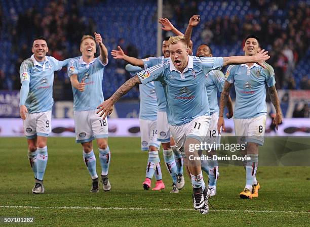 John Guidetti of Celta Vigo celebrates with teammates after Celta beat Club Atletico de Madrid 3-2 during the Copa del Rey Quarter Final 2nd Leg...