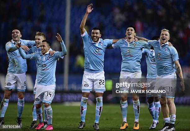 Celta Vigo players celebrate after winning their match during the Spanish Copa del Rey quarterfinal second leg football match Club Atletico de Madrid...