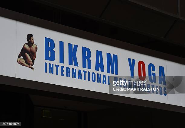 Sign outside the building housing the Worldwide headquarters of Bikram Yoga is seen in Santa Monica, California on January 27, 2016. Bikram...