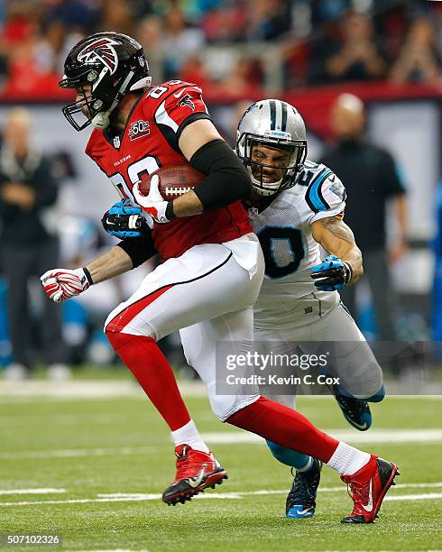 Jacob Tamme of the Atlanta Falcons against Kurt Coleman of the Carolina Panthers at the Georgia Dome on December 27, 2015 in Atlanta, Georgia.