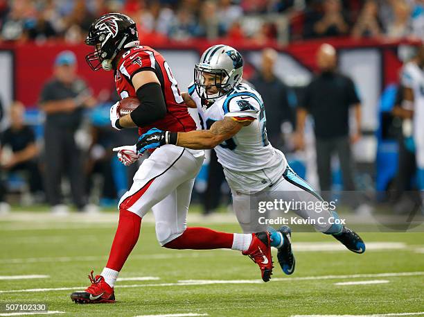 Jacob Tamme of the Atlanta Falcons against Kurt Coleman of the Carolina Panthers at the Georgia Dome on December 27, 2015 in Atlanta, Georgia.