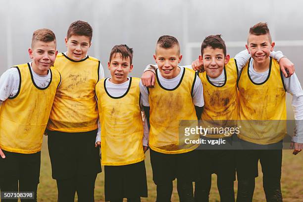 portrait of kids team after playing soccer - soccer team stock pictures, royalty-free photos & images