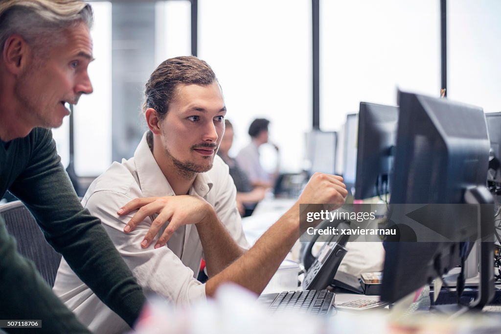 Businessmen reviewing some financial work