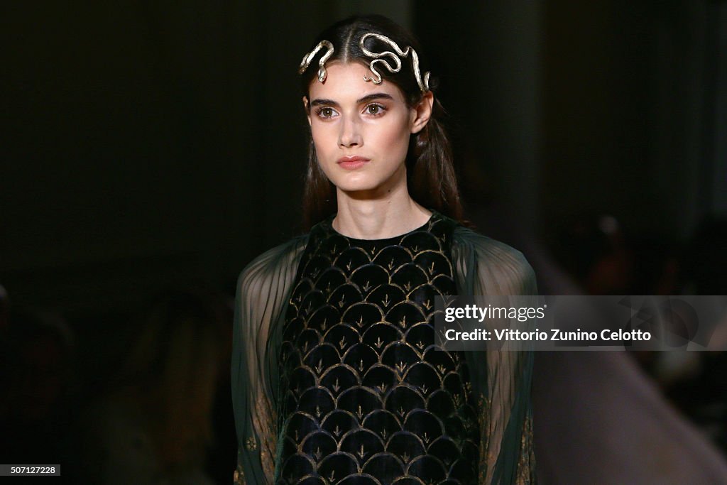 A model walks the runway during the Valentino Haute Couture Spring ...