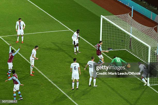 Crystal Palace goalkeeper Wayne Hennessey spills the ball through his legs from a headed effort by Joleon Lescott of Aston Villa resulting in the...