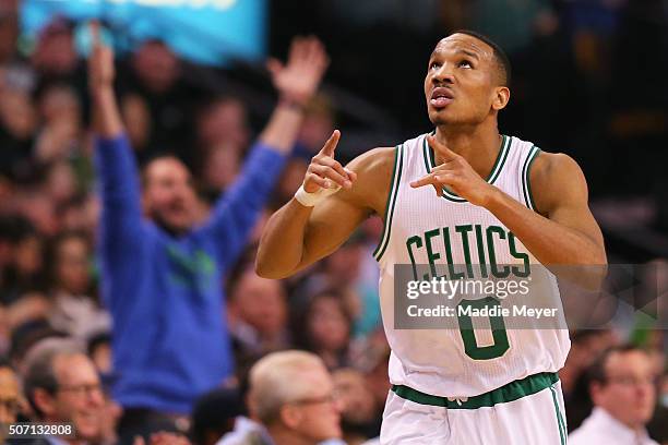 Avery Bradley of the Boston Celtics celebrates after hitting a three point shot against the Denver Nuggets during the second quarter at TD Garden on...