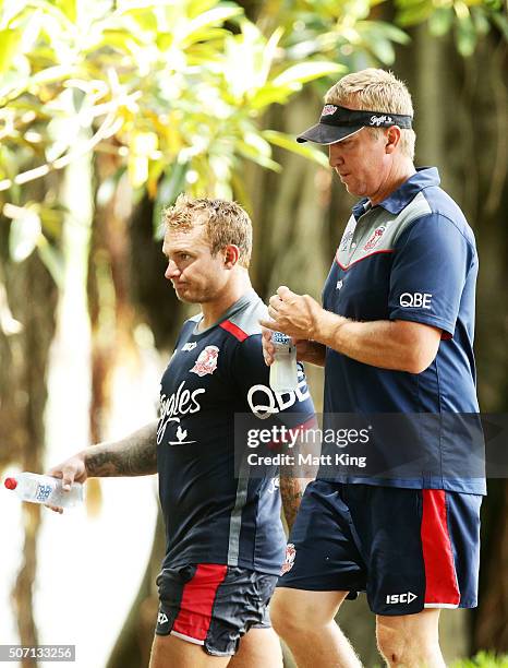 Roosters captain Jake Friend and Roosters coach Trent Robinson walk back after training during a Sydney Roosters training session on January 28, 2016...