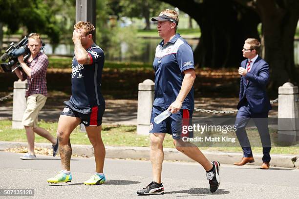 Roosters captain Jake Friend and Roosters coach Trent Robinson walk back after training during a Sydney Roosters training session on January 28, 2016...