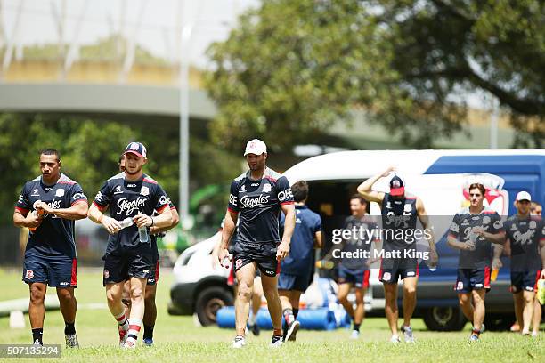 Roosters players walk back after training during a Sydney Roosters training session on January 28, 2016 in Sydney, Australia.