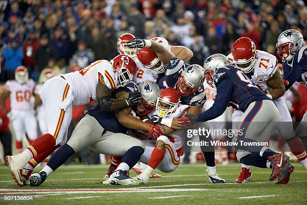 Playoffs: Kansas City Chiefs Charcandrick West in action, rushing and being tackled vs New England Patriots Akiem Hicks at Gillette Stadium....