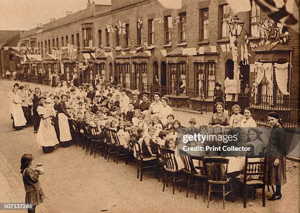 Children's tea party in an East End Street in London, to celebrate the Treaty of Versailles at the end of the First World War' . From These...