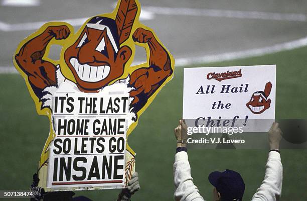 World Series: View of Cleveland Indians fans in stands holding sign that reads IT'S THE LAST HOME GAME SO LETS GO INSANE with Chief Wahoo logo and...