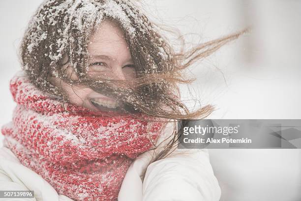 teenager girl under snowfall at the street - girl scarf bildbanksfoton och bilder