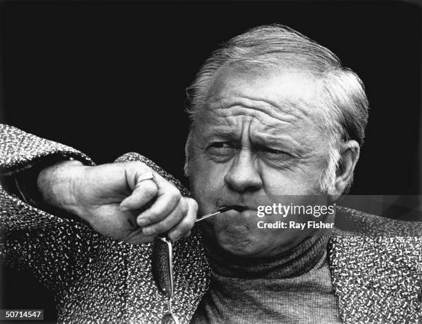 Actor Mickey Rooney looking very serious during a TV interview.
