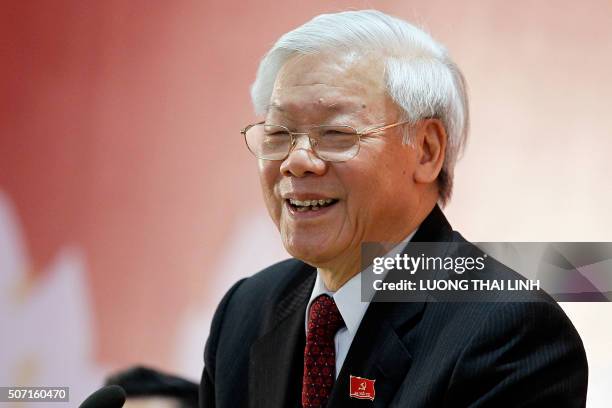 Newly re-elected Vietnam Communist Party Secretary General Nguyen Phu Trong speaks as a press conference after the closing ceremony on the final day...