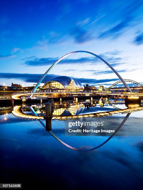 Gateshead Millennium Bridge connecting Gateshead and Newcastle upon Tyne, 2008. Floodlit view of the Millennium Bridge at twilight with The Sage and...