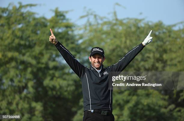 Gregory Bourdy of France celebrates after making a hole-in-one on the eighth hole during the second round of the Commercial Bank Qatar Masters at...