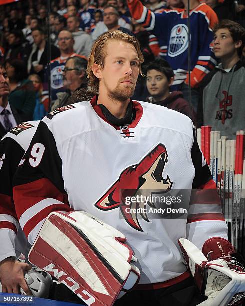 Anders Lindback of the Arizona Coyotes stands for the singing of the national anthem prior to the game against the Edmonton Oilers on January 2, 2016...