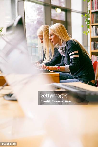 Student Behind Computer Students In Library Sitting Behind Computer Copy Space High-Res Stock ...