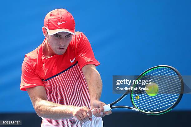 Oliver Anderson of Australia plays a backhand in his junior quarter finals match against Max Purcell of Australia during the Australian Open 2016...