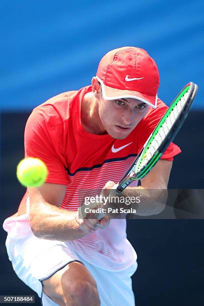 Oliver Anderson of Australia plays a backhand in his junior quarter finals match against Max Purcell of Australia during the Australian Open 2016...