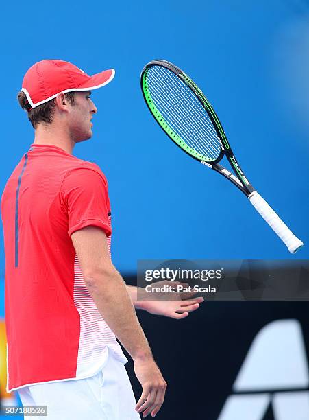 Oliver Anderson of Australia throws his racquet in his junior quarter finals match against Max Purcell of Australia during the Australian Open 2016...